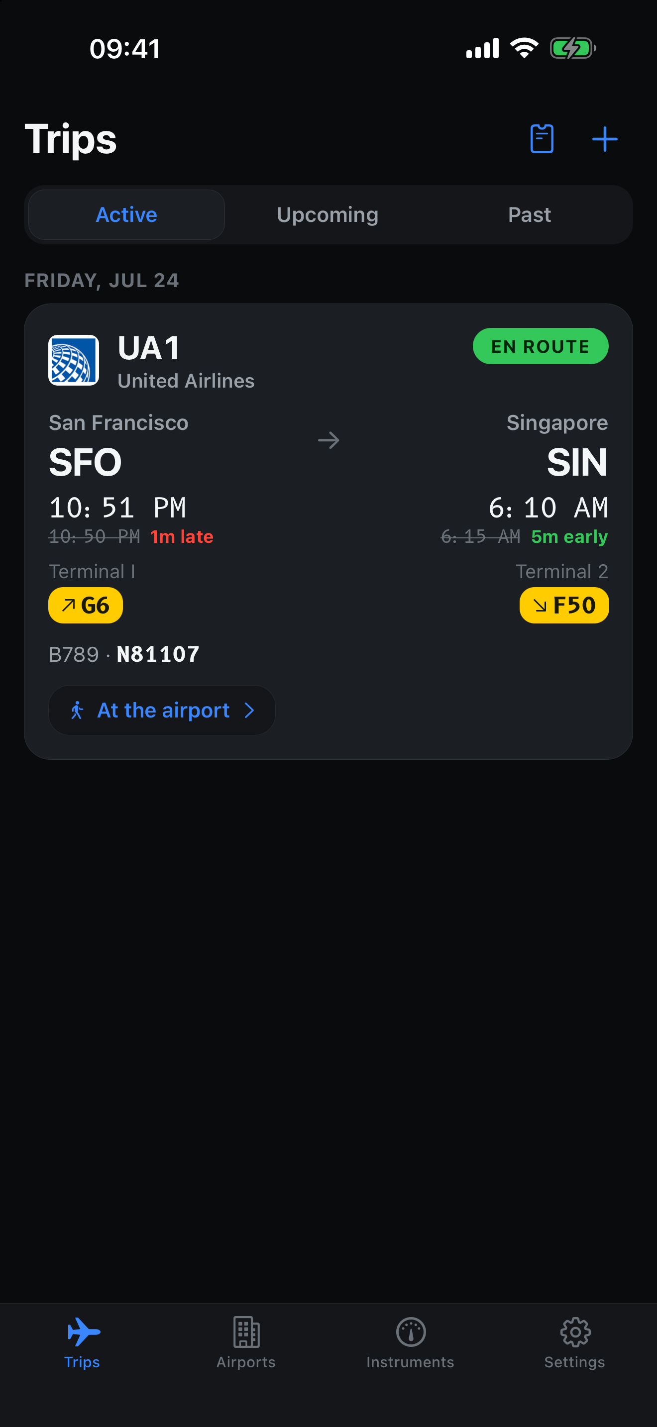 The trips list showing an active flight with terminal, gate and revised times.